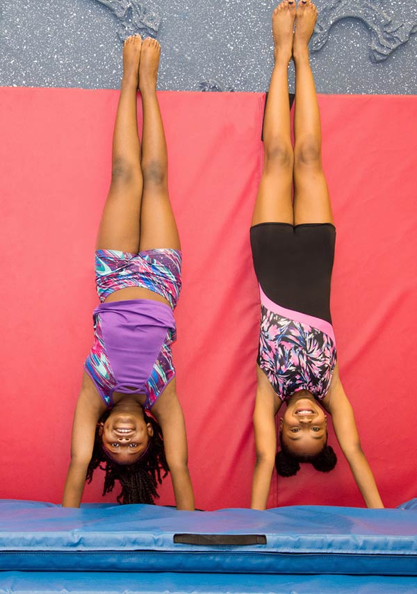 picture of two girls doing a handstand